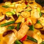 Chicken in red curry sauce with green string beans, eggplant, red and green bell pepper, bokchoy, shiitake mushrooms and kaffir lime leaves.