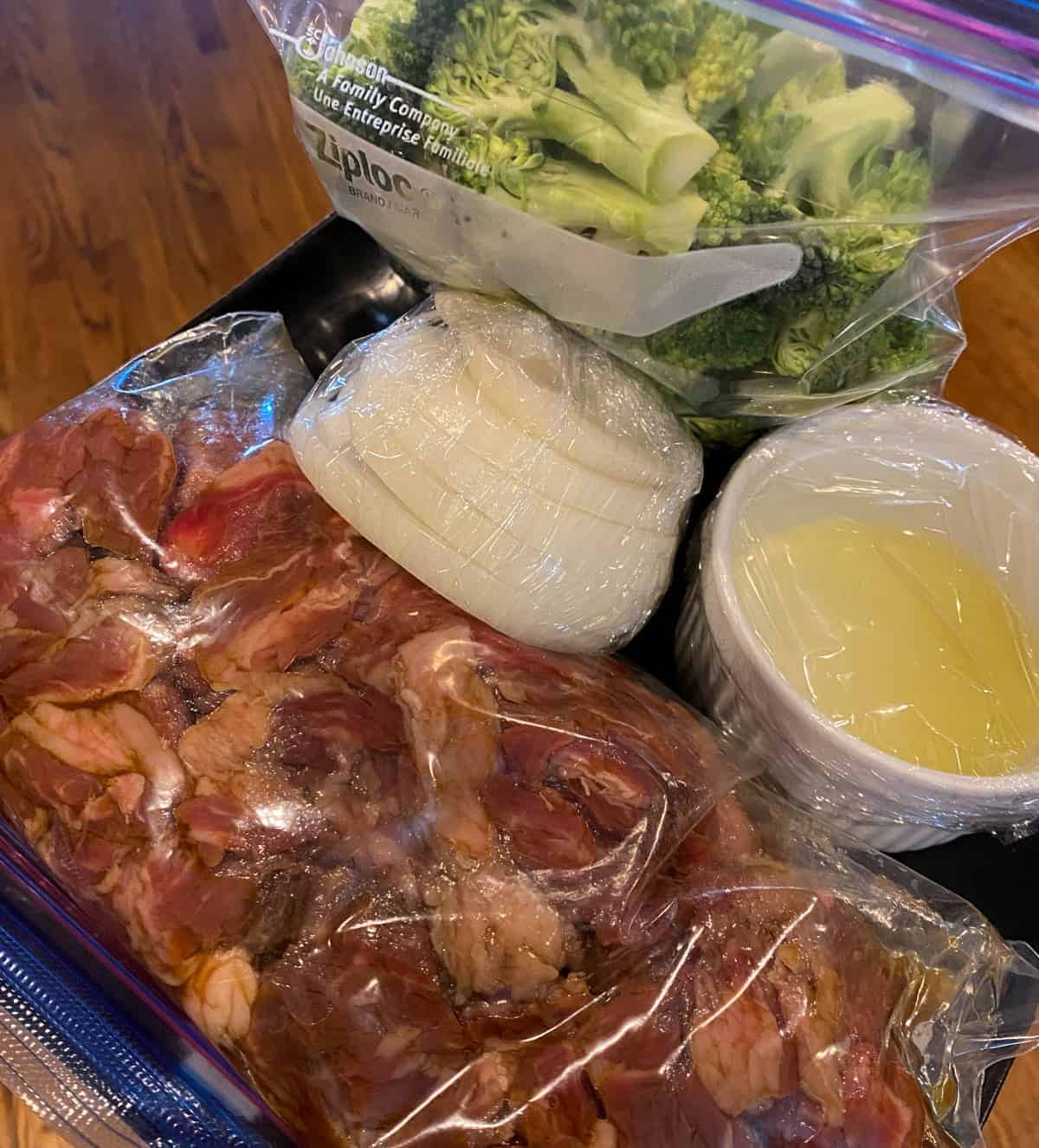 Ingredients for beef and broccoli cut and prepared ahead of time.