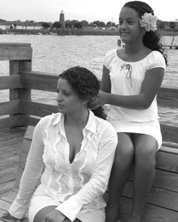 Lauressa and Dina mother and daughter picture in white dress braiding hair