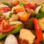 Cooked Chicken Afritada with Bell Peppers, Tomatoes, Onions, Carrots, Potatoes.