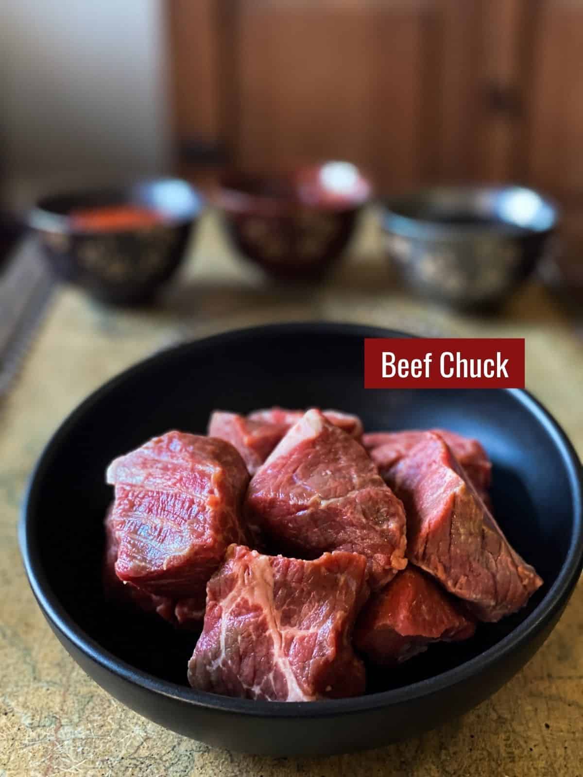 Beef chuck on a black bowl.