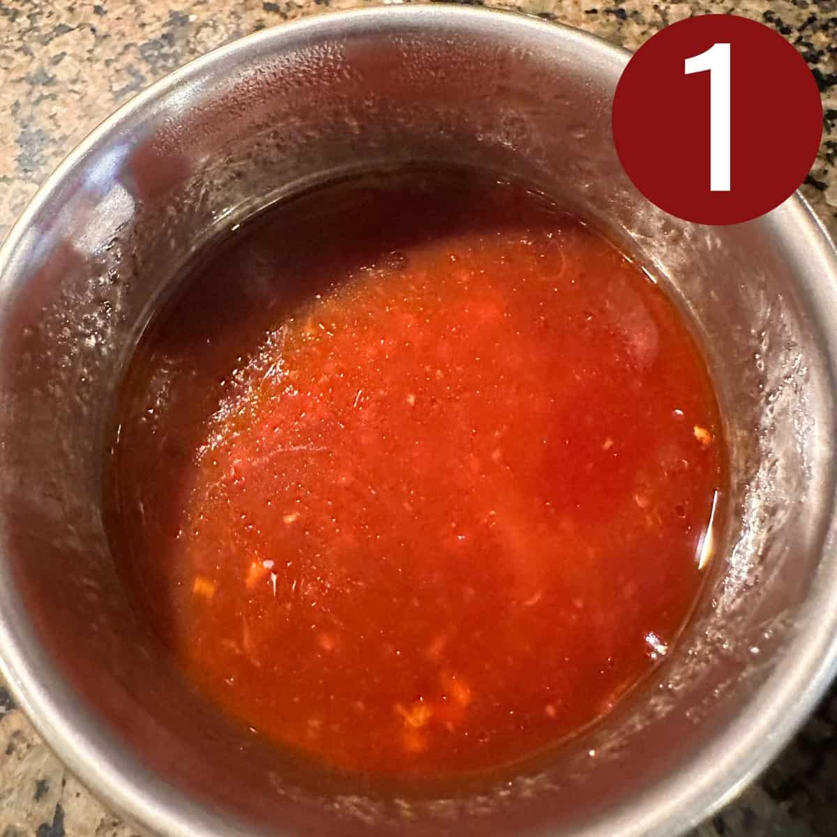 Huli huli sauce in a stainless steel bowl.