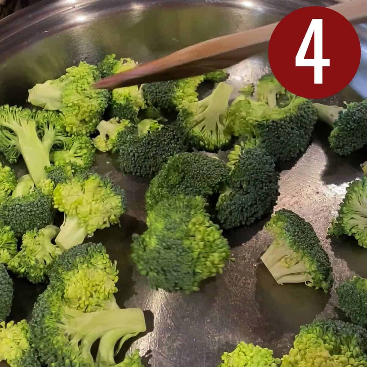 Cut broccoli florets for stir fry in a skillet.