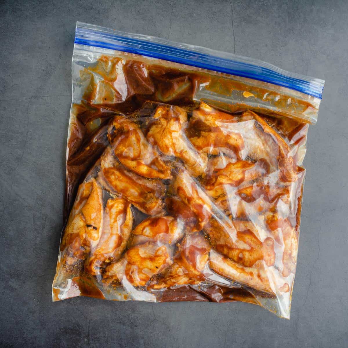 Marinated chicken wings in ziploc bag.