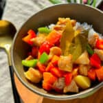 Filipino pork menudo in a ceramic bowl.